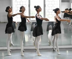 An image of four students at the barre. 